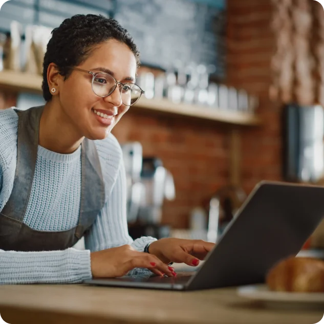 Restaurant owner using UpMenu on a laptop