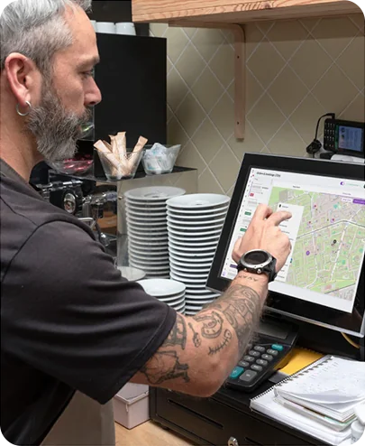 Restaurant staff managing delivery orders from dashboard