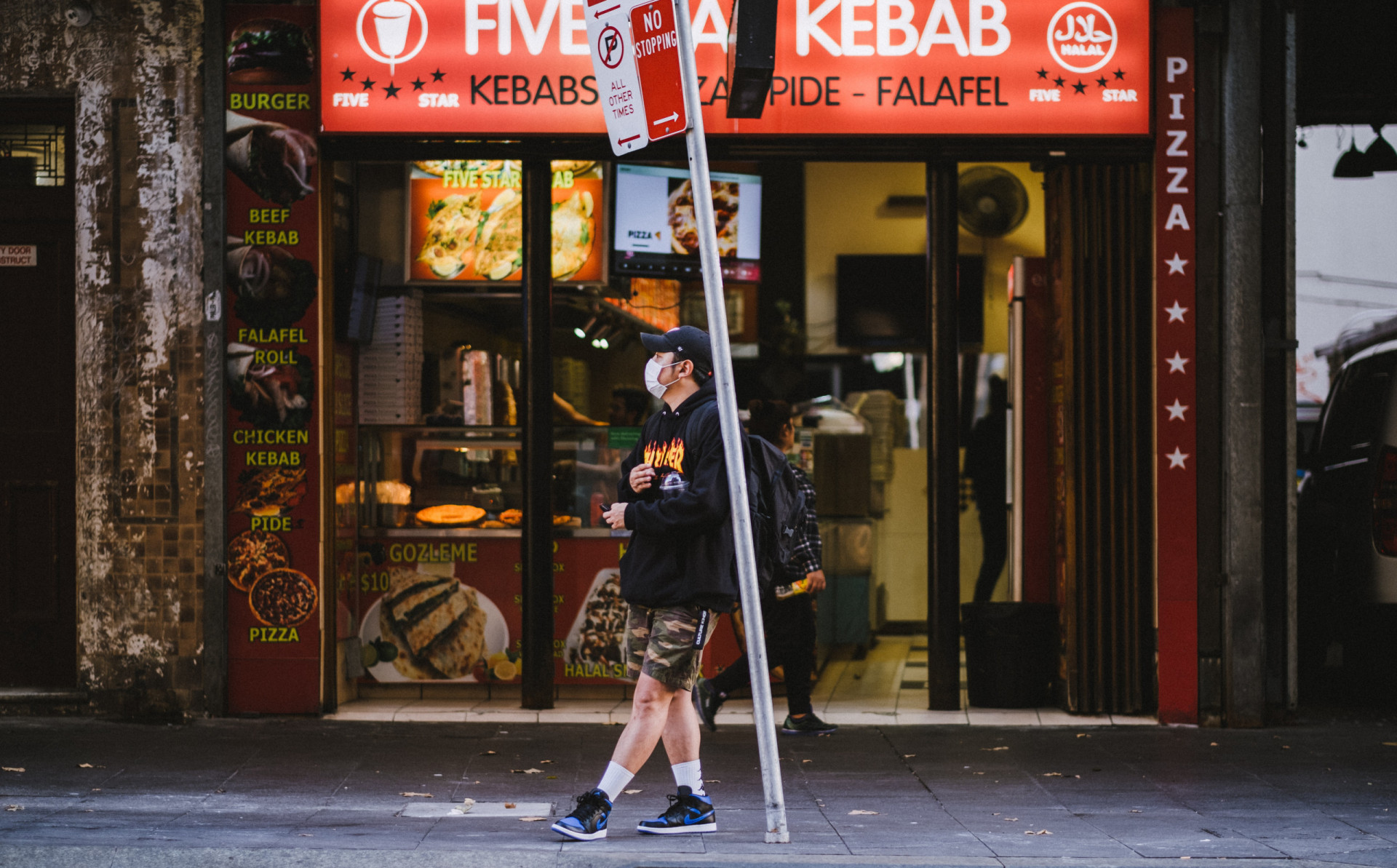 Customer waiting to receive takeout is safe way.