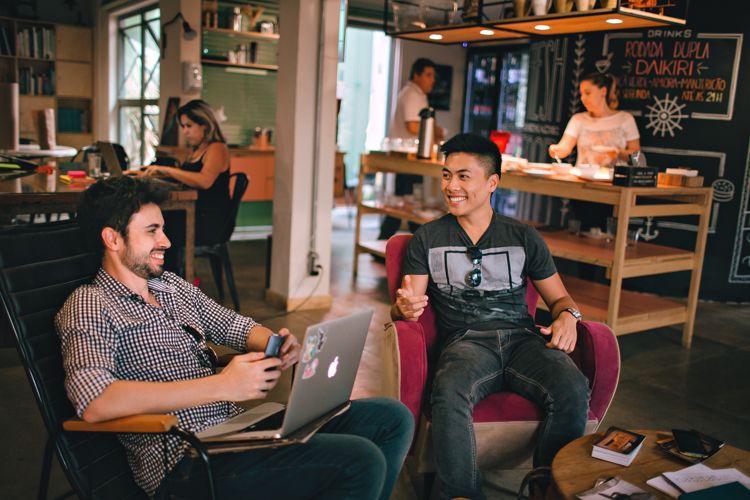 2 men working on restaurant marketing.