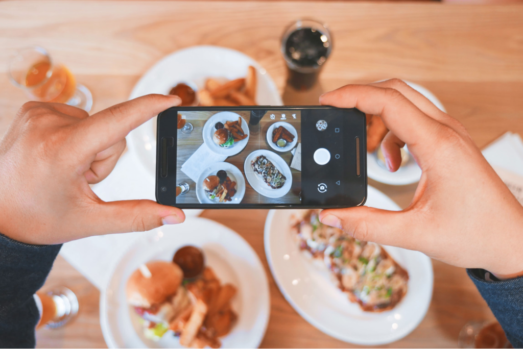 how to do video marketing for restaurants - an example photo of a person shooting a video with a phone